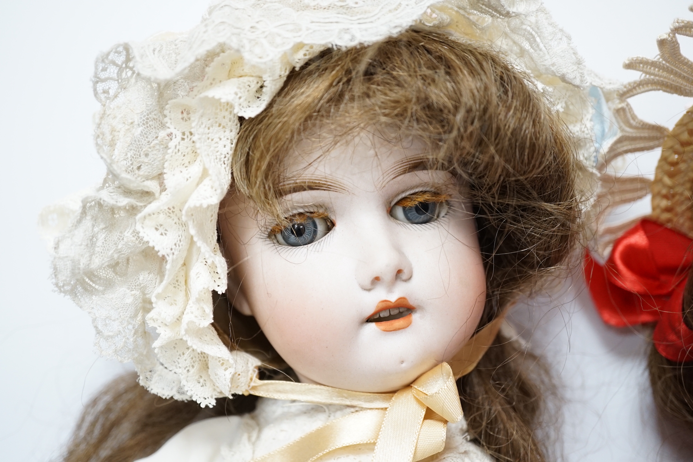 A Gebruder Kuhnlenz K168 doll, 58cm, good condition, and a Heinrich Handwerck Simon & Halbig doll, 45cm